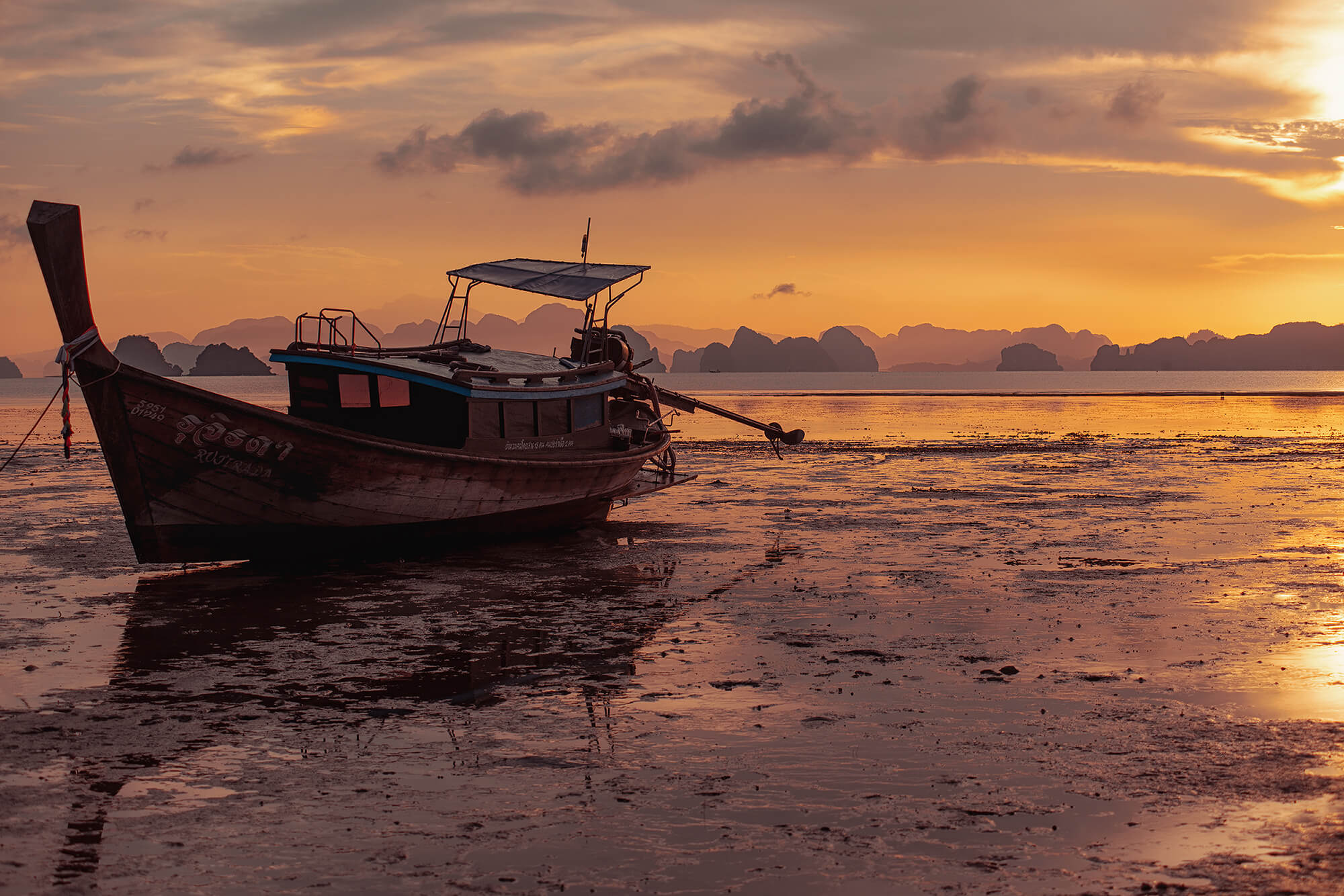 Sunrise from Koh Yao Yai with longtail-boat